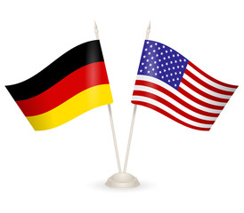 Table stand with flags of Germany and USA. 