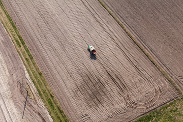 aerial view of the tractor on harvest field