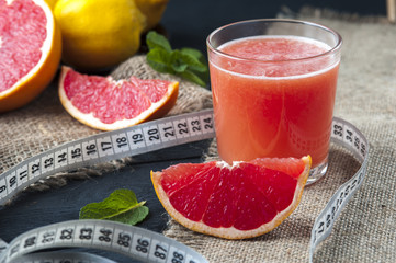 Measuring tape and grapefruit juice
