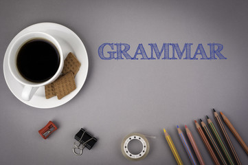 Gray office desk with the inscription - Grammar