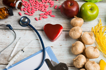 healthcare concept balance between medicine and healthy foods