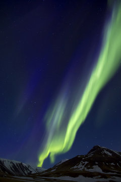 Northern Lights above mountains edge