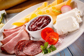 Breakfast - bacon, cottage cheese, bread and vegetables