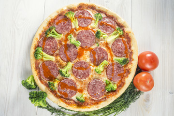tasty Pizza on wooden table background. Top view with copy space