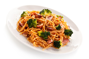 Pasta with pesto sauce, ham, Parmesan and broccoli