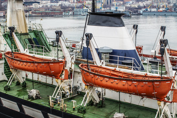 two orange lifeboats on the ship's davits