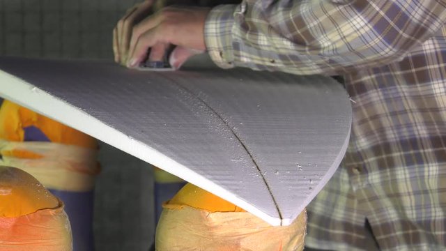 cutting and shaping the surfboard