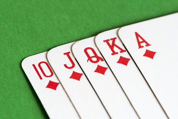 Playing card on green table, Straight flush