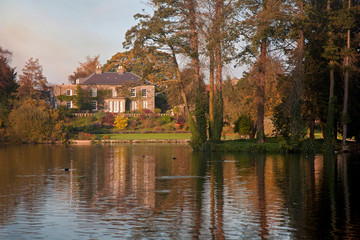 Fototapeta na wymiar House Across the Lake at Sunset