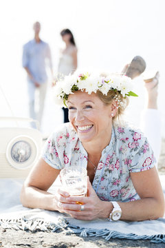 Smiling woman wearing flower wreath
