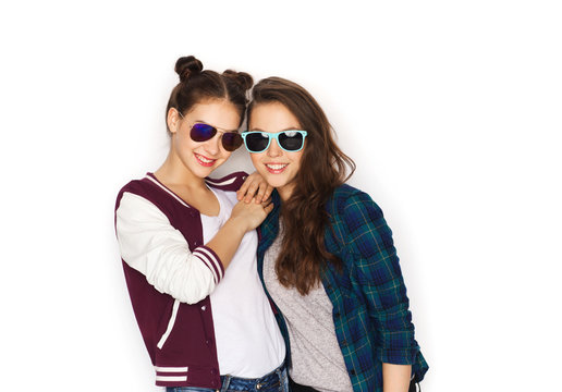 happy smiling pretty teenage girls in sunglasses
