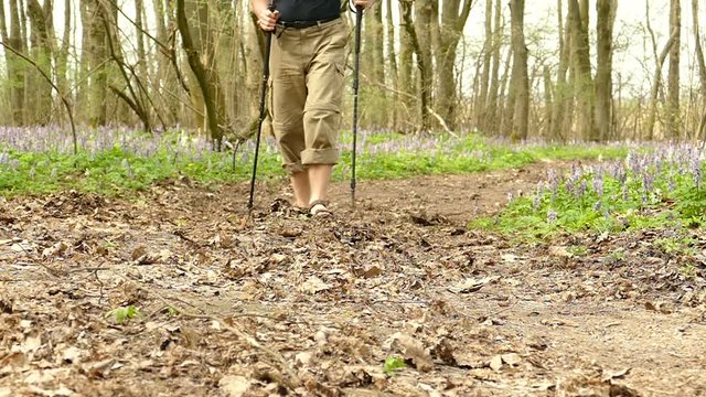 
Feets of  Man hiker  in  spring wood. Healthy lifestyle. Slow motion at 100 FPS
