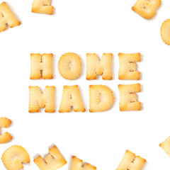 home made message written with homemade biscuits, on white background