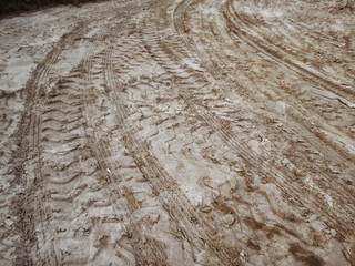 Wheel tracks on the soil.