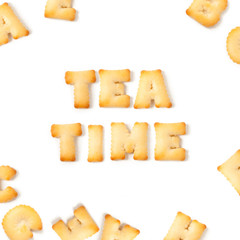 tea time message written with homemade biscuits, on white background
