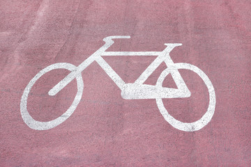 Fototapeta na wymiar Bike signal over red asphalt