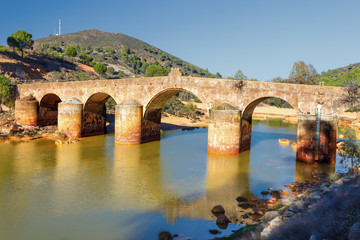 Obraz premium Old bridge in San Rafael on the Odiel river, Spain