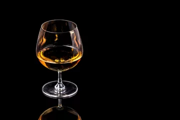 Goblet of Brandy on the black background
