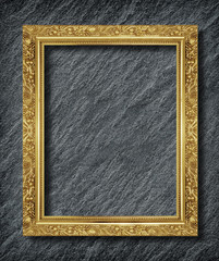 gold frame on  black slate background