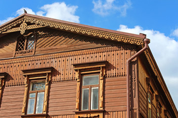 Fototapeta na wymiar House is in Russian style of the second half of the 19th century with a wooden facade, Andriyivskyy Descent 19, Kyiv, Ukraine