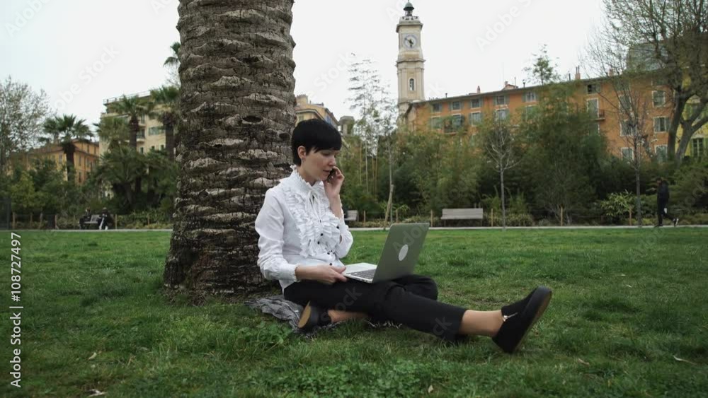 Aufkleber she talking using app on the mobile phone her fingers with natural manicure typing on laptop.freelan