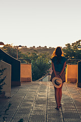 Girl walking and looking at the cityscape