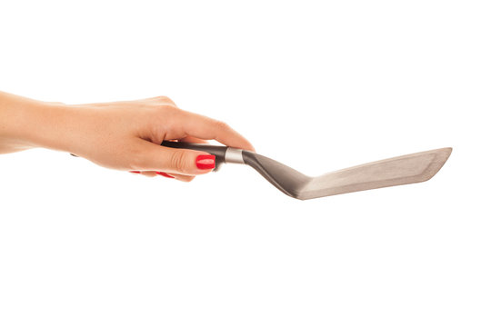 Woman Hand Holding A Kitchen Spatula Isolated On White Background