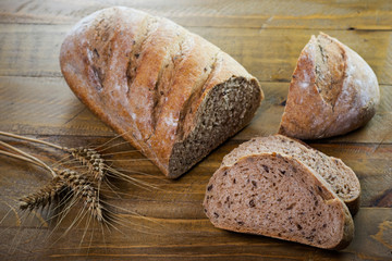 Crusty cereal bread in a rustic composition