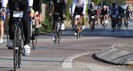 Fototapeta na wymiar many cyclists with fast race bike during the cycling race