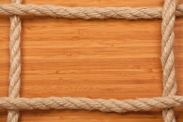 Toned photo. Color tone tuned. frame made of rope on wooden board