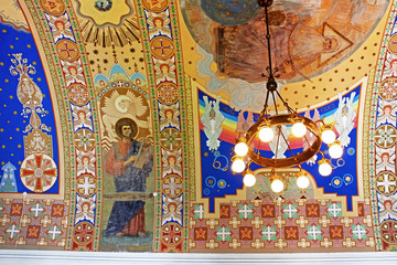 Naklejka premium Lamp and hand-painted ceiling in Uzhhorod Castle (Ukraine). Built between the 13th and 18th centuries