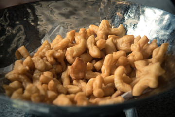 photo set of process deep fried dough stick  ' patongko '