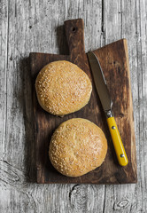 Hamburger  homemade buns on rustic wooden board