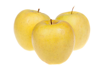 Three yellow delicious apple fruits, isolated on white background