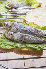Sandwich Kamut, tapas with sardines, sprats with olives and herb