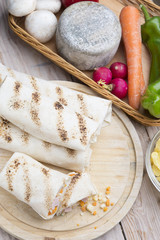 a healthy wrap with turkey, greens and cheese