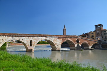 Fototapeta premium Ponte Pietra on river Adige, ancient roman bridge in the old town of Verona, Italy 
