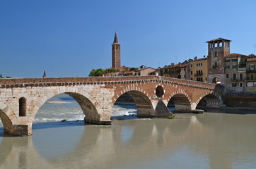 Fototapeta premium Ponte Pietra on river Adige, ancient roman bridge in the old town of Verona, Italy