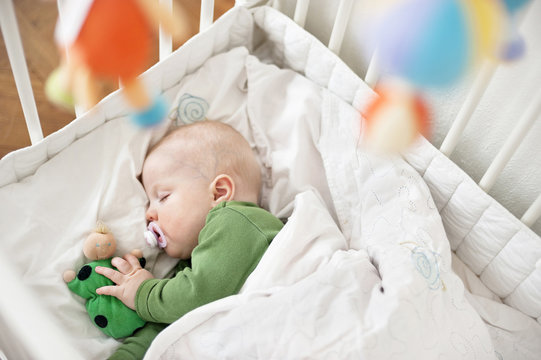 Baby Sleeping In Cot