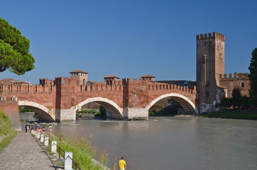 Fototapeta premium Medieval stone bridge Ponte Scaligero across the river Adige and tower of Castelvecchio, Verona, Northern Italy. 