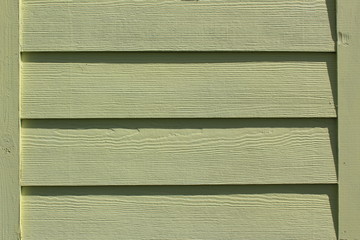 Yellow concrete siding wall