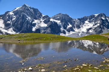 Fototapeta na wymiar Alpine lake on the Ortles Massif, in South Tyrol, Italy