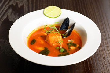 salmon soup with vegetables close up