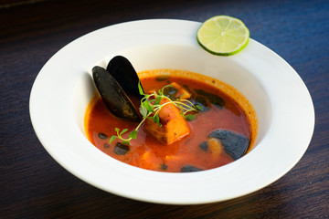 salmon soup with vegetables close up