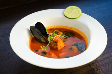 salmon soup with vegetables close up