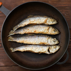 fried smelt on a frying pan