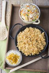 Different rice dishes (paella with vegetables, tomato and rice p