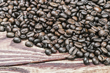 roasted coffee beans on a wooden table