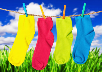 colorful socks hanging from a rope