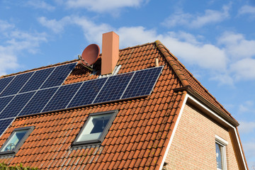Fototapeta premium house with solar panels on the roof